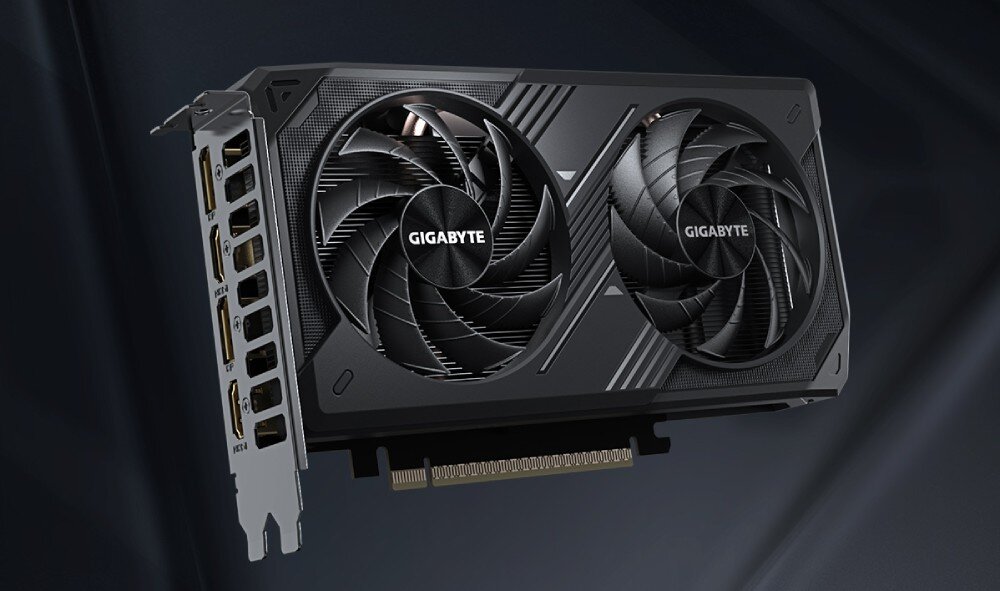 Komputer MAD DOG ARYA-A15WR16WP Karta graficzna z dwoma wentylatorami. Po lewej stronie widoczny jest panel złącza z pięcioma portami wideo, w tym HDMI i DisplayPort. Na środku wentylatorów widnieje logo 'GIGABYTE', karta graficzna, rdzenie CUDA, grafika, wentylatory