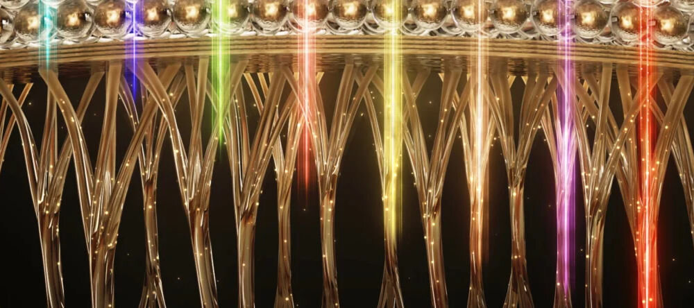 Maska LED FOREO Faq 202 tylizowana grafika przedstawiająca różne kolory światła LED (od czerwonego po fioletowy), które są emitowane i transportowane przez światłowodową strukturę przypominającą włókna, symbolizując technologię urządzenia. * Maska-5.jpg: Szeroki kąt ujęcia maski LED złożonej na stole, cała powierzchnia maski świeci jasnym czerwonym światłem.
 