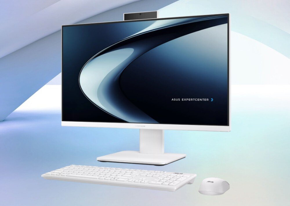 Komputer All in One ASUS ExpertCenter P440VAK-WPC204X Komputer typu All in One z dopasowaną klawiaturą oraz myszką komputerową, zaprezentowany na jasnoniebieskim, geometrycznym tle z widoczną na ekranie grafiką przedstawiającą pastelowe fale, opis