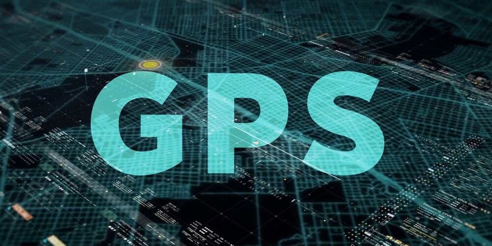 Na obrazie widoczny jest napis \'GPS\' na tle mapy z siatką i punktami świetlnymi.