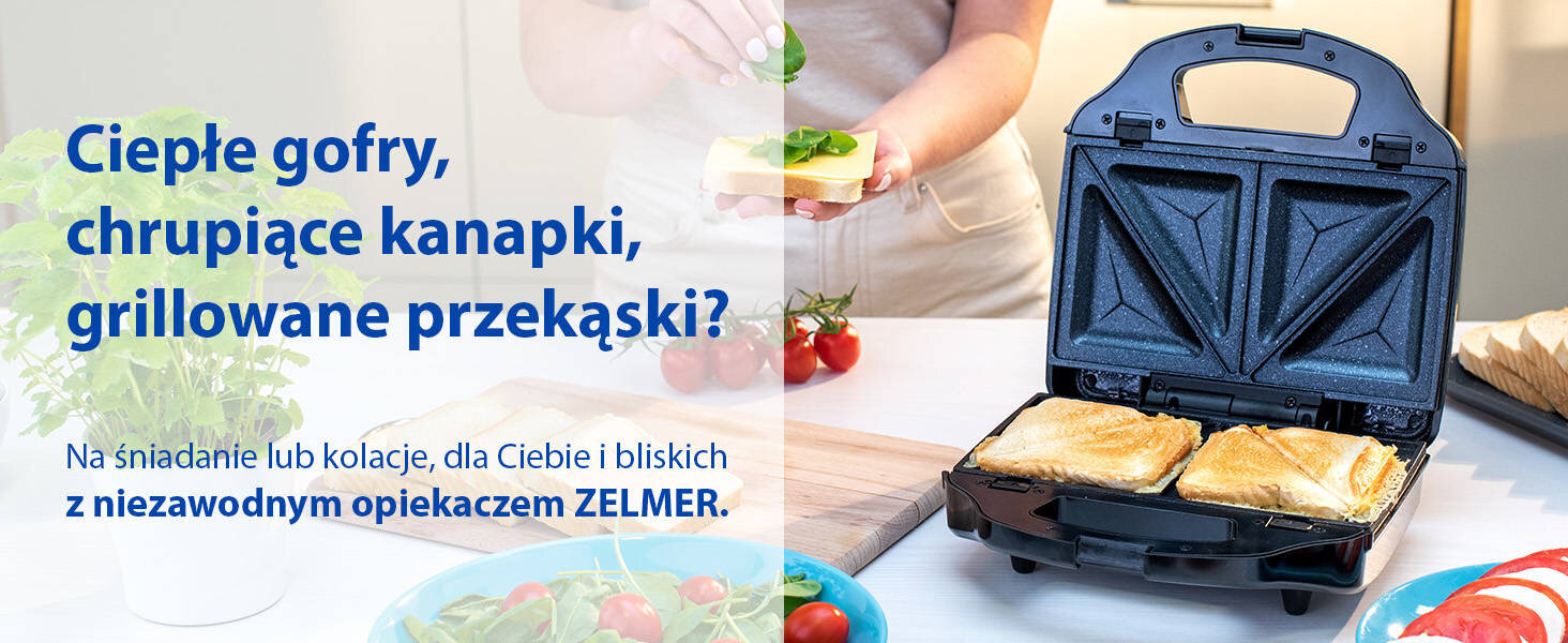 Na obrazie widoczny jest opiekacz z dwoma kanapkami w środku oraz osoba przygotowująca kanapkę. Tekst na obrazie: \'Ciepłe gofry, chrupiące kanapki, grillowane przekąski? Na śniadanie lub kolację, dla Ciebie i bliskich z niezawodnym opiekaczem ZELMER.\'