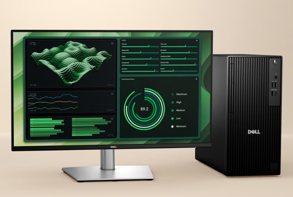 Komputer DELL Pro Tower QCT1250 Czarna jednostka centralna komputera stojąca obok dużego monitora, który wyświetla panoramiczne zdjęcie zalesionych wzgórz i gór w świetle dziennym, ekologia, recykling