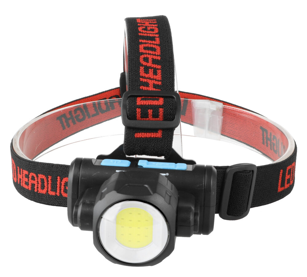 Czarna latarka czołowa z obrotową głowicą i żółtym panelem LED, zamocowana na elastycznym pasku z napisem \'LED HEADLIGHT\' w kolorze czerwonym.