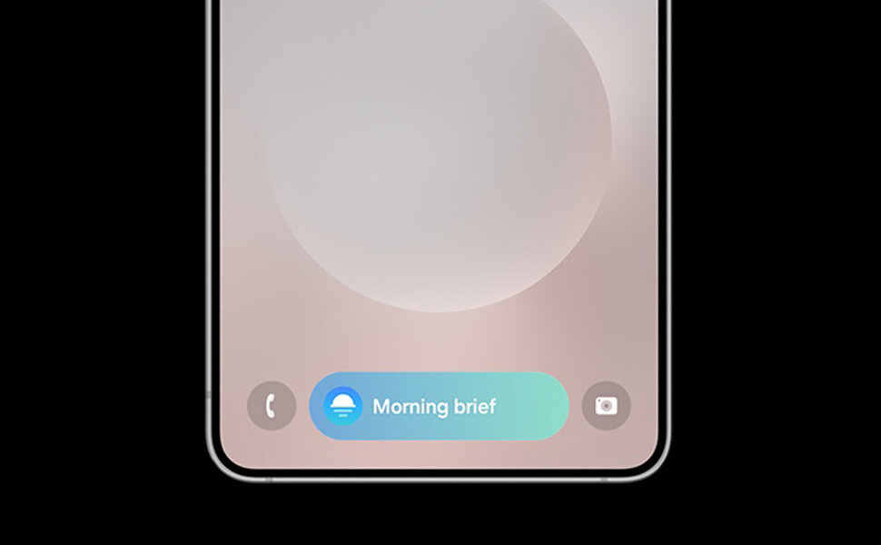 Dolna część ekranu smartfona z widocznymi ikonami telefonu, aplikacji \'Morning brief\' oraz aparatu na tle gradientu.