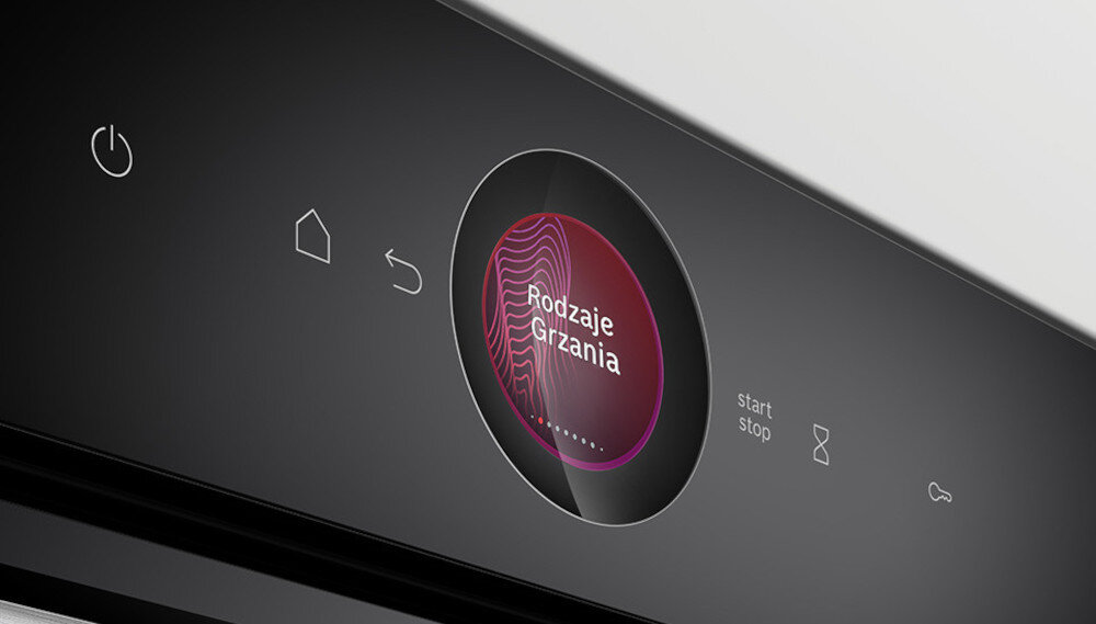 PIEKARNIK BOSCH HBG7242BB1 Na panelu sterowania piekarnika widać dotykowe ikonki oraz okrągły wyświetlacz z napisem „Rodzaje Grzania”. Ujęcie podkreśla czytelność i wygodę obsługi wyświetlacz panel TFT wizualizacje potraw czytelne komunikaty