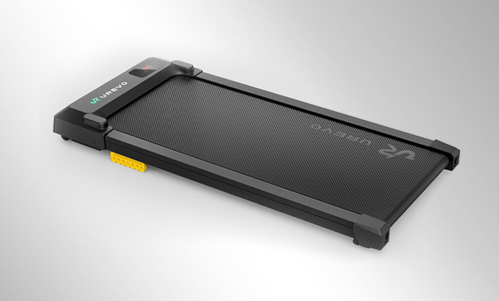 Bieżnia elektryczna UREVO Spacewalk E1L 1865W 6.4 km-h bieżnia na szarym tle codzienny ruch bez konieczności wychodzenia z domu smukła konstrukcja ułatwia przechowywanie pięciowarstwowy pas z ośmiopunktową amortyzacją wyświetlacz LED SmartControl aplikacja UREVO APP