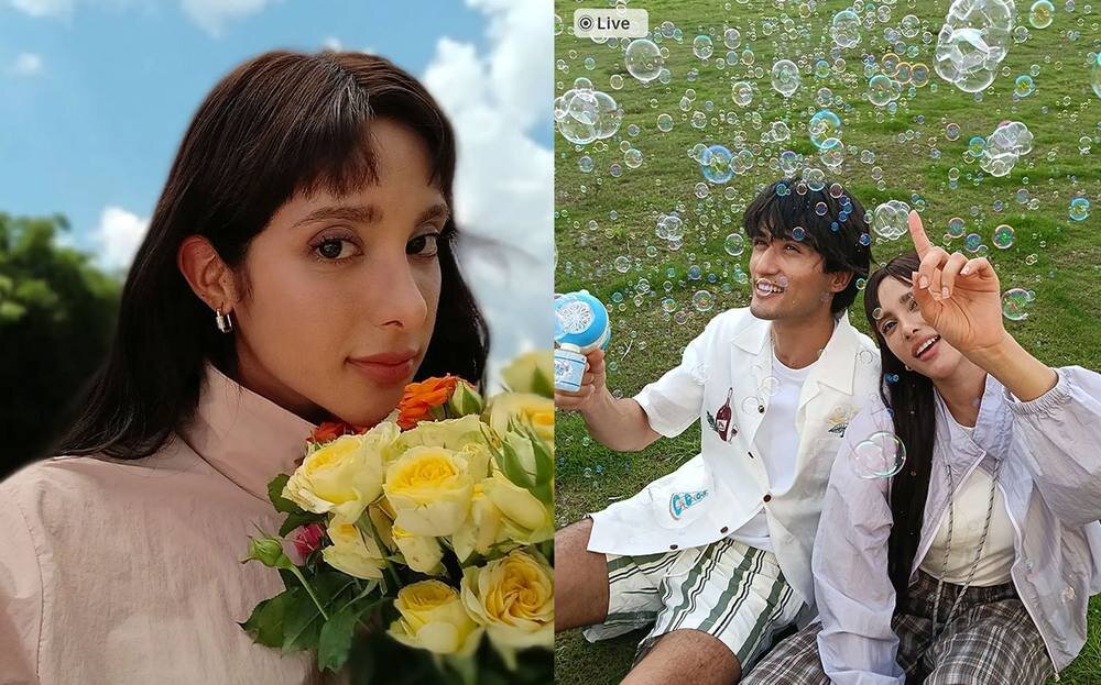 Kobieta z bukietem żółtych róż patrzy w stronę aparatu oraz para siedząca na trawie wśród baniek mydlanych