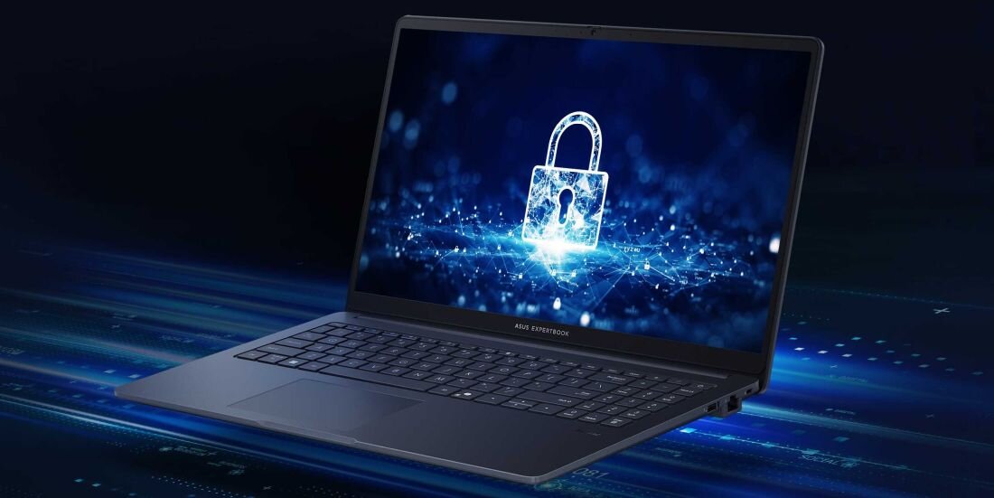 Laptop z wyświetlaczem pokazującym grafikę z kłódką na tle cyfrowych wzorów. Na obudowie widoczny napis \'ASUS EXPERTBOOK\'.
