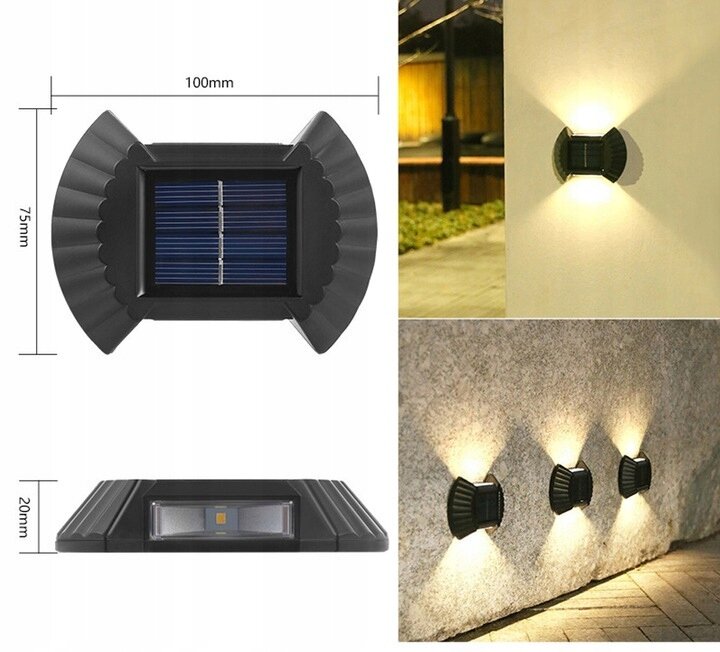 Obraz przedstawia czarną lampkę solarną o wymiarach 100mm x 75mm x 20mm, zamontowaną na ścianie, emitującą światło w dwóch kierunkach. Widać również trzy lampki zamontowane na kamiennej ścianie, oświetlające przestrzeń poniżej.