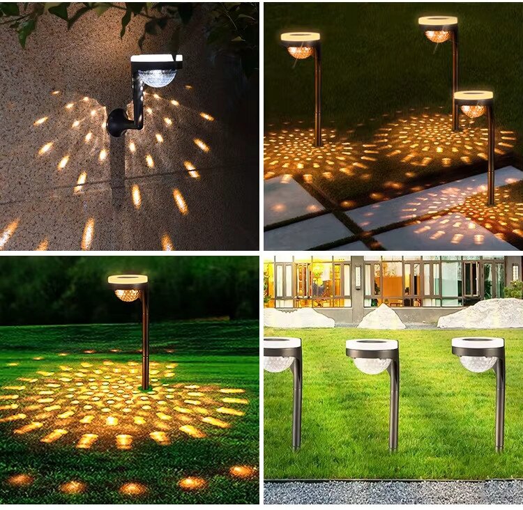 Obraz przedstawia kilka lamp solarnych ogrodowych wbijanych w ziemię, emitujących ciepłe, rozproszone światło na powierzchnię wokół nich. Lampy są umieszczone na trawniku oraz przy ścieżce, tworząc dekoracyjne wzory świetlne.