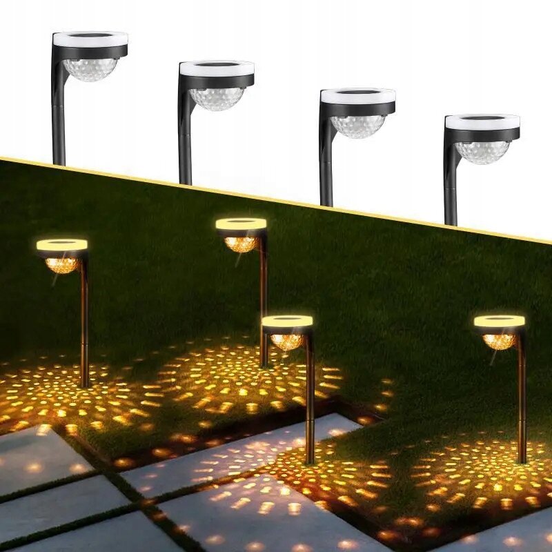 Obraz przedstawia kilka lamp solarnych ogrodowych wbijanych w ziemię, emitujących ciepłe, żółte światło na trawniku. Lampy mają okrągłe klosze i tworzą wzory świetlne na podłożu.