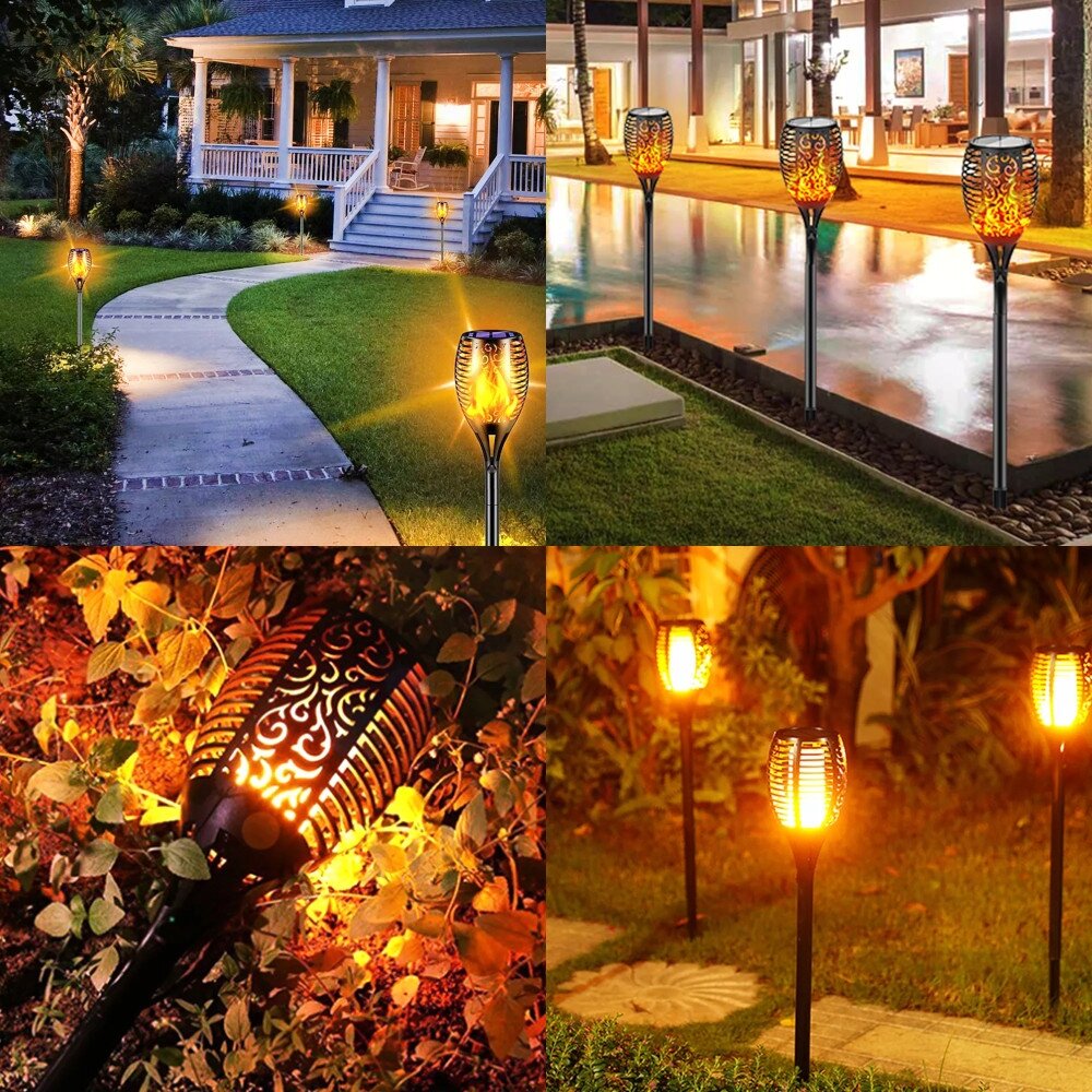 Obraz przedstawia kilka lamp solarnych w kształcie pochodni, emitujących ciepłe, żółte światło przypominające płomień. Lampy są umieszczone w ogrodzie oraz wzdłuż ścieżki, tworząc przytulną atmosferę.