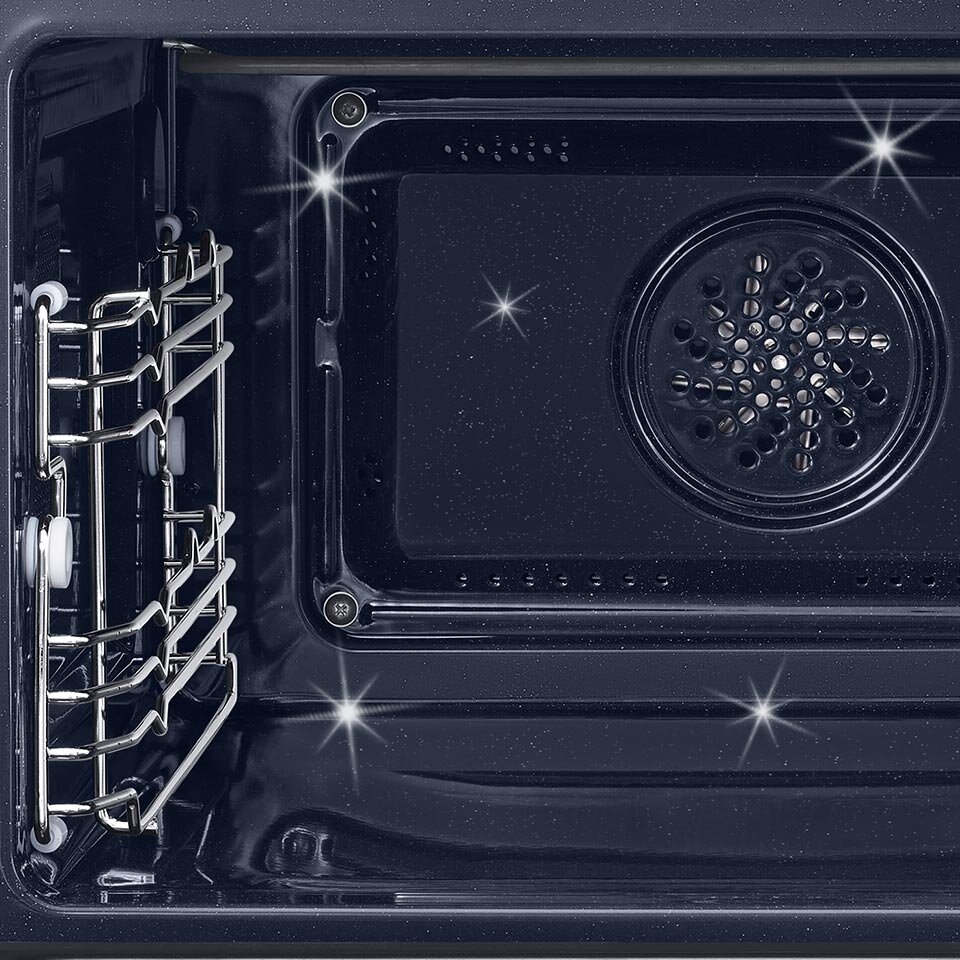 Emalia ceramiczna znajdująca się we wnętrzu kuchenki lśni czystością Emalia ceramiczna znajdująca się we wnętrzu kuchenki lśni czystością