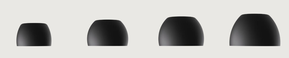 Słuchawki dokanałowe BEATS Solo Buds cztery rozmiary wkładek, dopasowanie do ucha, izolacja akustyczna, 4 rozmiary wkładek na szarym tle