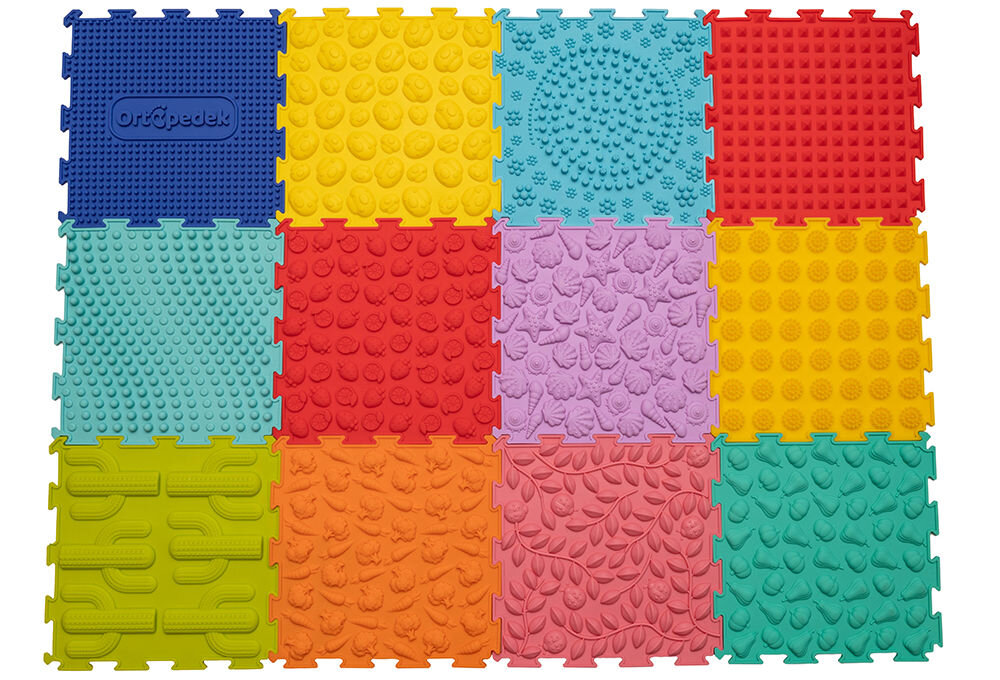 Mata sensoryczna ORTOPEDEK 128948 24.5 x 24.5 cm (12 elementów) Wielokolorowy Osiem trójkątnych puzzli sensorycznych Ortopedek w pastelowych kolorach (żółtym, zielonym, różowym, fioletowym i błękitnym) ułożonych w kształt koła. Każdy element posiada wypukłe wzory w kształcie dziecięcych stóp.