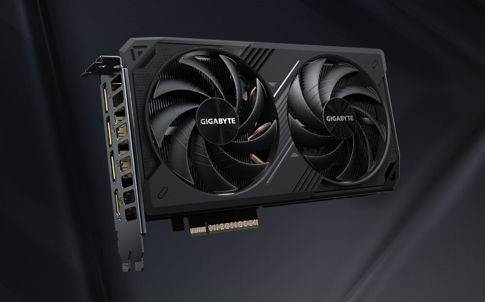 Komputer MAD DOG GeForce RTX5060Ti DLSS 4 Reflex Edition 2 STELLAR-I01WB32WH Karta graficzna z dwoma wentylatorami. Po lewej stronie widoczny jest panel złącza z pięcioma portami wideo, w tym HDMI i DisplayPort. Na środku wentylatorów widnieje logo 'GIGABYTE', karta graficzna, rdzenie CUDA, grafika, wentylatory