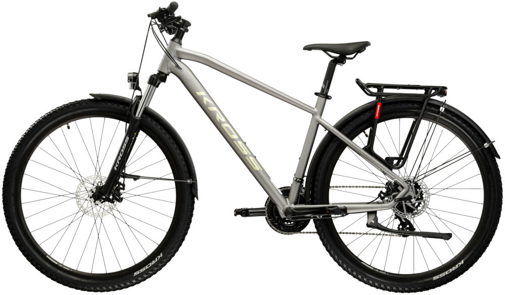 Rower górski MTB KROSS XPRT SUV M20 29 cali męski Srebrno-szampański rower na białym tle widoczny z boku łańcuch marki KMC typu HV500 odpowiednia konstrukcja ogniw wspiera płynną współpracę z kasetą i zębatkami ułatwia zmianę przełożeń bardziej równomierne przenoszenie mocy mniejsze zużycie pozostałych elementów napędu