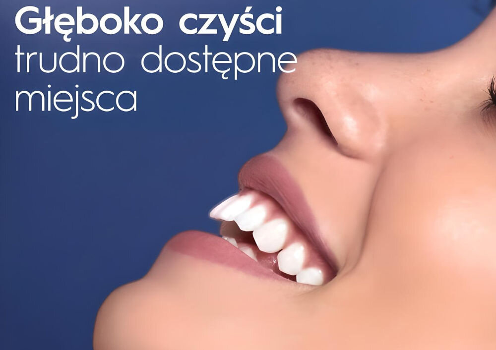 Irygator ORAL-B Oral Health Center twarz uśmiech białe zęby niebieskie tło kompleksowa higiena jamy ustnej technologia OxyJet strumień wody nasycony mikropęcherzykami usuwanie resztek jedzenia płytki nazębnej bakterii dotarcie do trudno dostępnych miejsc delikatny masaż poprawa kondycji dziąseł regulacja ciśnienia dostosowanie intensywności strumienia ergonomiczna konstrukcja wygoda zbiornik 600 ml 