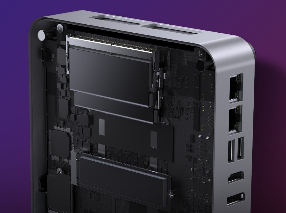 Komputer CHUWI AuBox-P-K4 Wnętrze komputera z widocznymi slotami pamięci RAM, gniazdami M.2 i bocznymi portami, pokazane na tle fioletowego gradientu, pamięć, taktowanie, dysk, pojemność