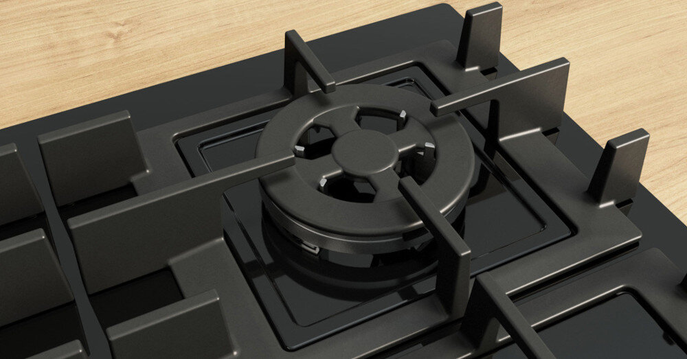 PŁYTA BOSCH PNH6B6K40 Na zdjęciu przedstawiono centralny palnik płyty gazowej z solidnym, masywnym rusztem żeliwnym. Błyszcząca powierzchnia szkła wokół palnika podkreśla staranne wykonanie i elegancki charakter urządzenia pojedyncze żeliwne lekkie łatwe czyszczenie poręczne ruszty kompaktowe zmywarka czyszczenie wygoda gotowania