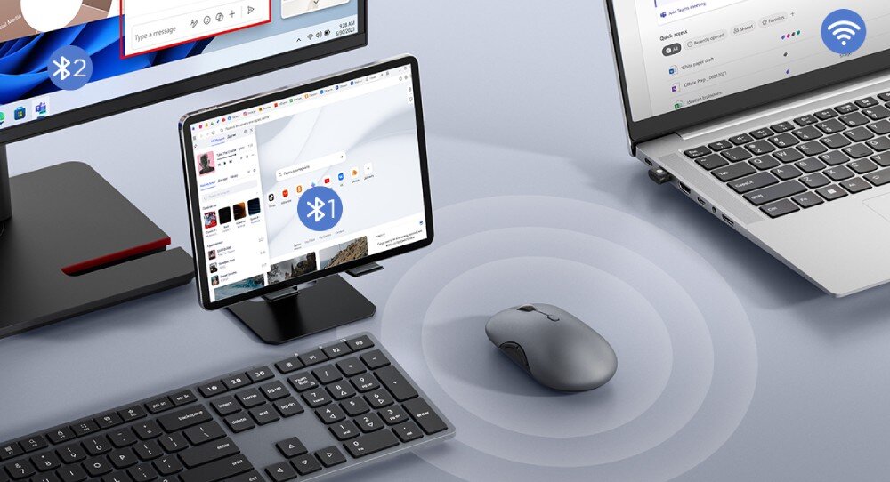 Mysz LENOVO 700 Multi-Device Mysz komputerowa na biurku otoczona ikonami 'Bluetooth 1', 'Bluetooth 2' oraz 'Wi-Fi', wskazującymi połączenie z tabletem, monitorem i laptopem