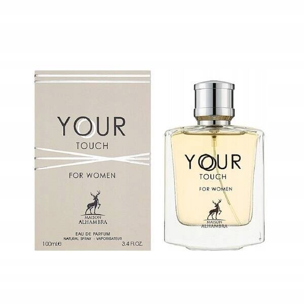Obraz przedstawia flakon perfum oraz pudełko z napisem \'YOUR TOUCH FOR WOMEN\'. Na pudełku widnieje logo z jeleniem oraz tekst \'MAISON ALHAMBRA EAU DE PARFUM NATURAL SPRAY VAPORISATEUR 100ml e 3.4 FL.OZ.\'.
