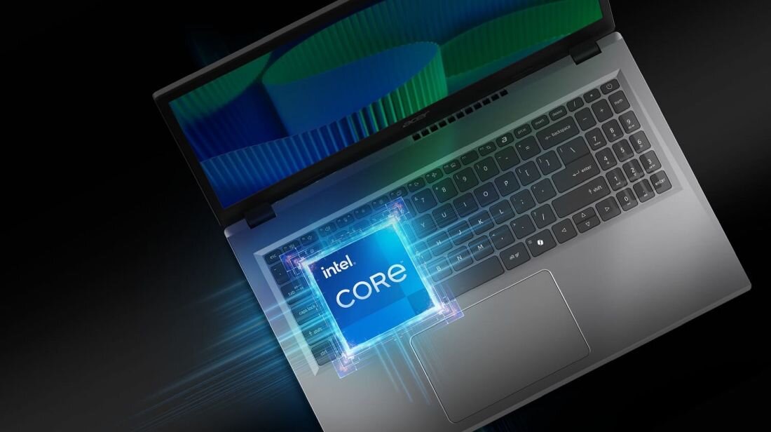 Obraz przedstawia laptop z widoczną klawiaturą i ekranem, na którym wyświetlany jest kolorowy wzór. Na pierwszym planie znajduje się logo \'intel core\'.