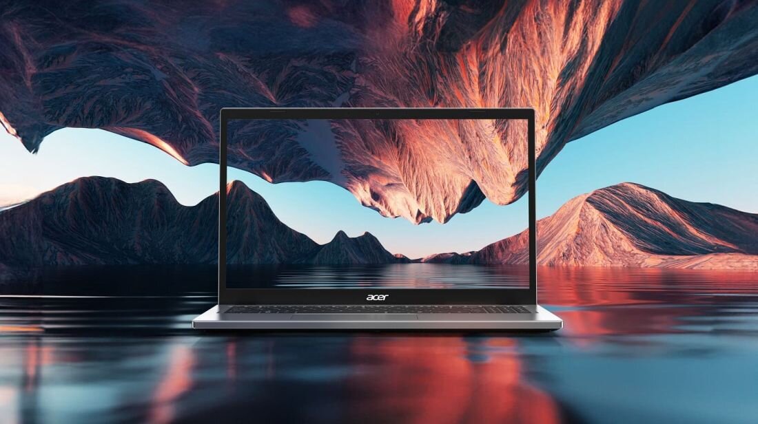 Laptop z logo \'acer\' na obudowie, wyświetlający krajobraz z górami i wodą. Tło obrazu przedstawia podobny krajobraz z odbiciem w wodzie.