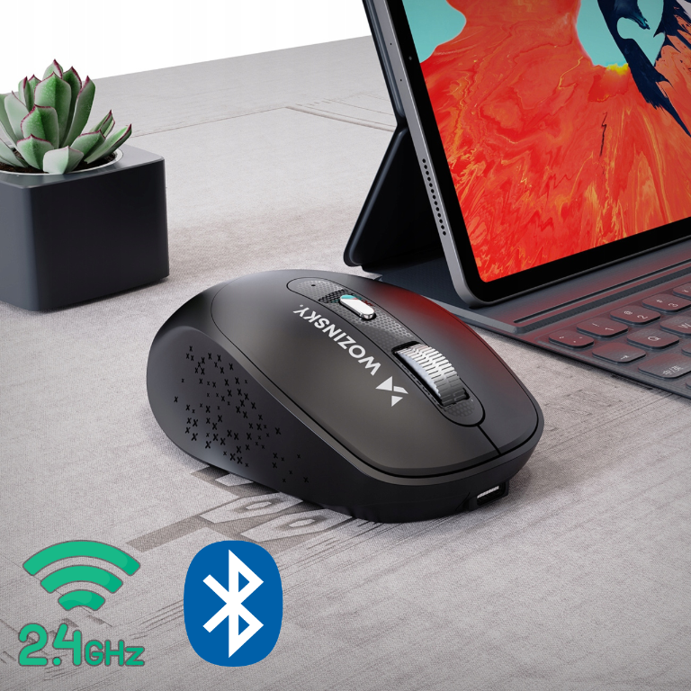 Na obrazie znajduje się czarna mysz bezprzewodowa z napisem \'WOZINSKY\', obok tabletu z klawiaturą. W dolnym rogu widoczne są ikony łączności 2.4 GHz i Bluetooth.