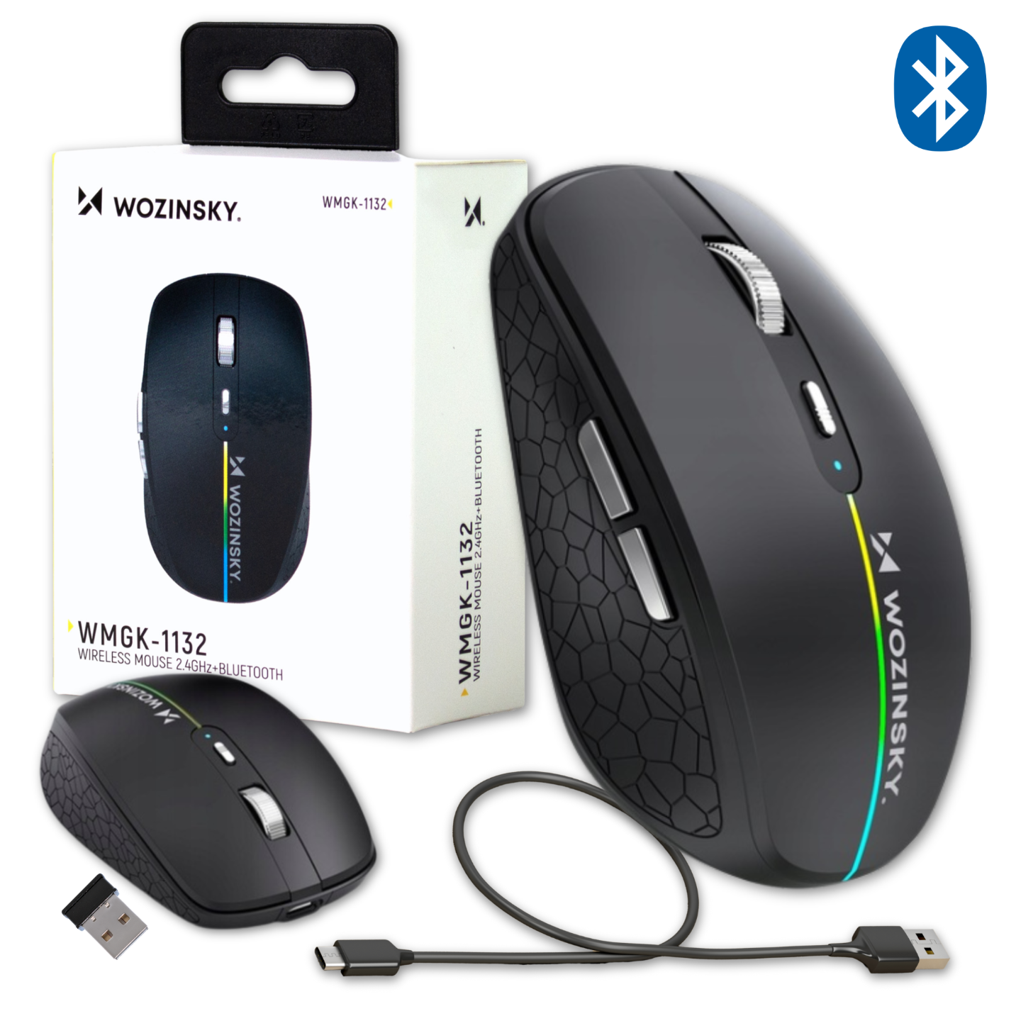 Na obrazie znajduje się czarna mysz bezprzewodowa z podświetleniem RGB oraz opakowanie z napisem \'WOZINSKY WMGK-1132 WIRELESS MOUSE 2.4GHz+BLUETOOTH\'. Obok myszy leży kabel USB-C i adapter USB.