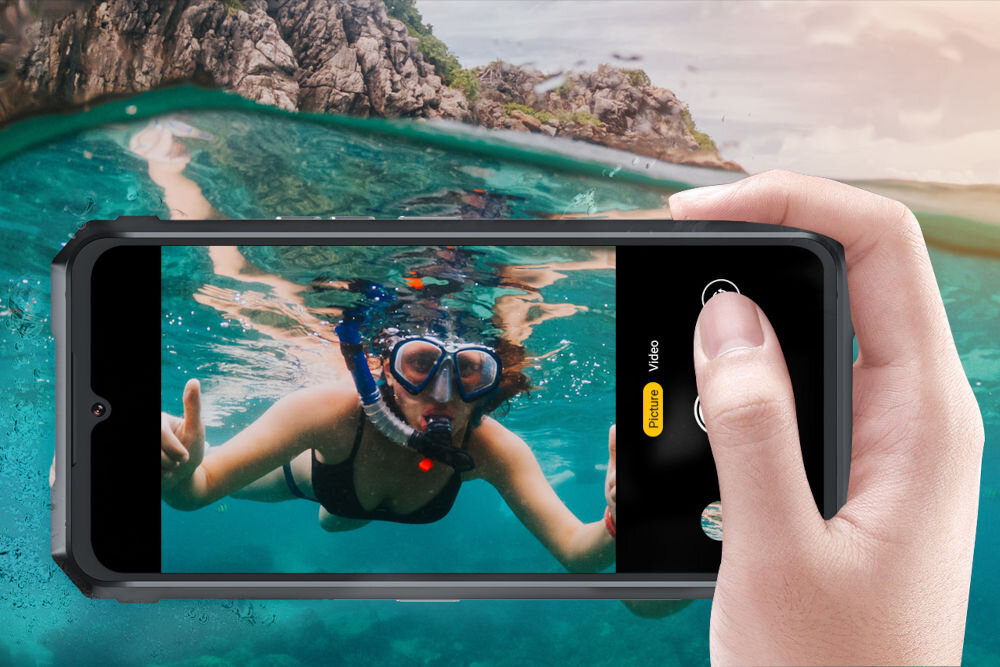 Smartfon CUBOT King Kong 11 5G 16/256GB 6.72 120Hz Czarny Ekran smartfona Cubot wyświetlający ujęcie podwodne z kobietą w masce i fajce do nurkowania, w trybie robienia zdjęcia, podkreślające wodoodporność i możliwości fotograficzne