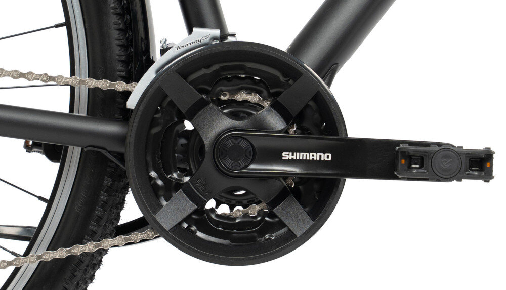 Rower trekkingowy ROMET Wagant SUV H PV A U20 28 cali Czarny zbliżenie na kasetę i korbę kaseta SHIMANO typu CS-HG500 stalowa korba marki SHIMANO typu FC-TY501 płynna zmiana przełożeń i łatwe dopasowanie siły pedałowania do warunków terenu przyjemność i efektywność