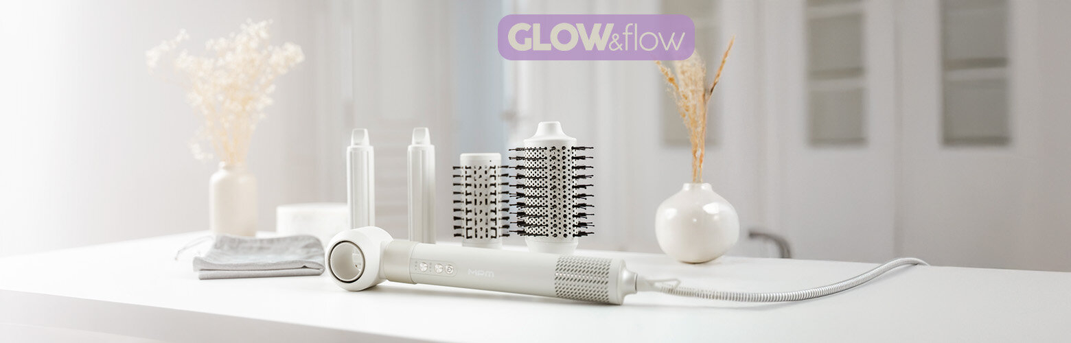 Suszarko-lokówka 5w1 MLW-27 na blacie różnymi końcówkami do stylizacji włosów.