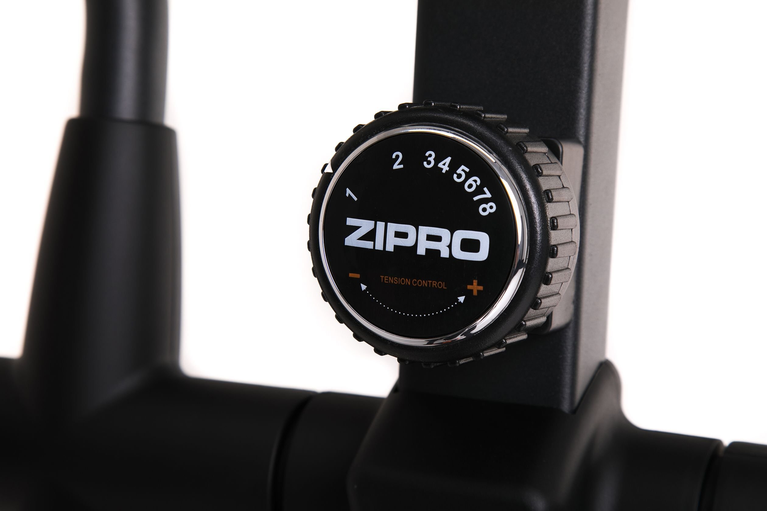Zdjęcie przedstawia pokrętło z napisem \'ZIPRO\' oraz oznaczeniami liczbowymi od 1 do 8 i napisem \'TENSION CONTROL\'.