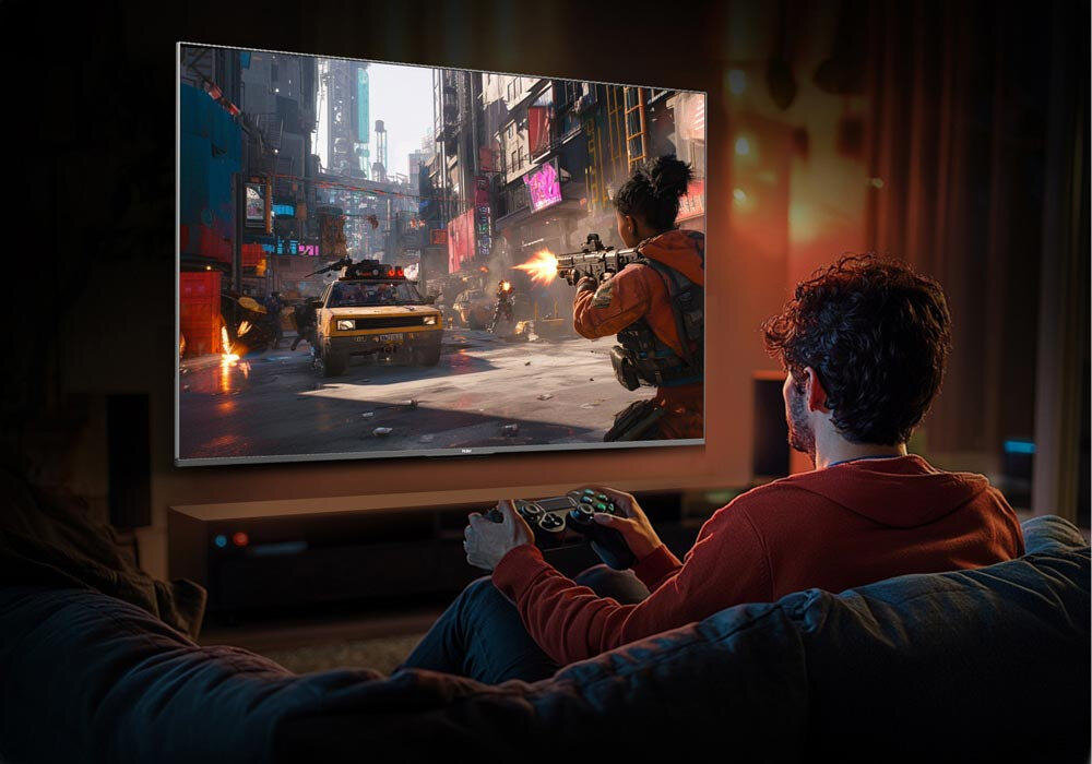 HAIER H55M90EUX pamięci operacyjnej 3 GB RAM 32 GB wbudowanej pamięci serwisy multimedialne i gry z Google Play - facet grający w grę