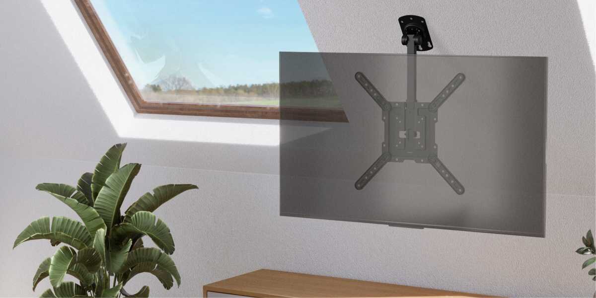 Uchwyt HAMA do TV 32-65 cali 220877 Czarny Czarny uchwyt sufitowy Hama zamontowany na skośnym poddaszu, podtrzymujący telewizor pod oknem dachowym.