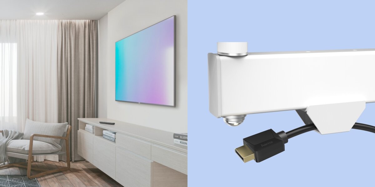 Uchwyt HAMA do TV 19-48 cali 220855 Biało-czarny Biały uchwyt do telewizora zintegrowany z organizerem kabli, w którym umieszczono czarny przewód HDMI.