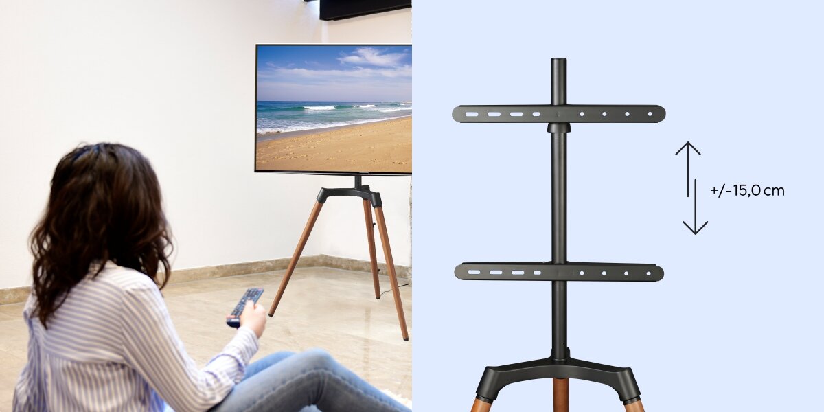 Stojak podłogowy HAMA do TV 32-65 cali 220873 Kobieta siedząca na podłodze przed telewizorem na stojaku Hama oraz schemat pokazujący regulację wysokości o +/- 15 cm.