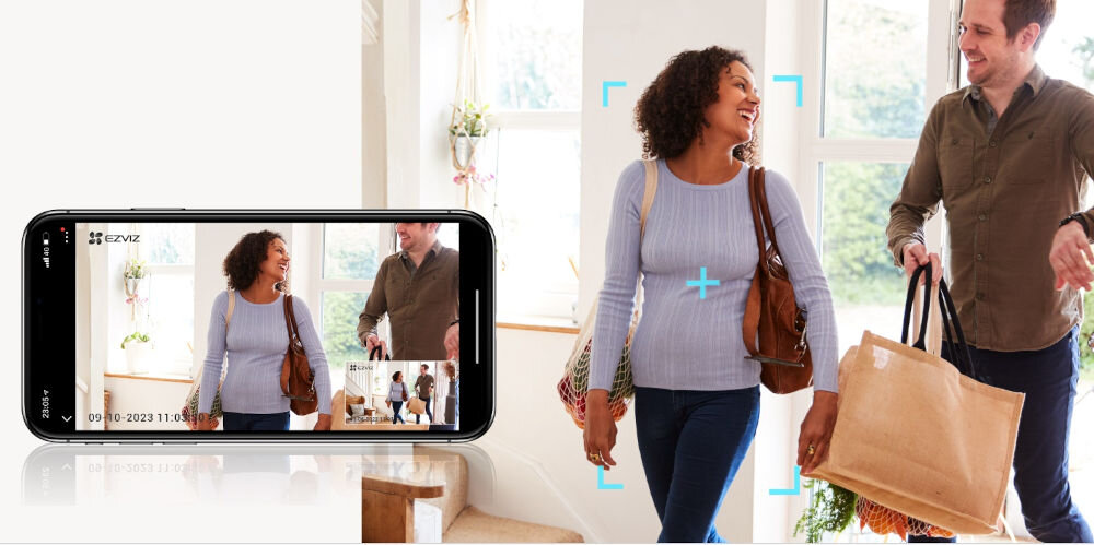 Kamera EZVIZ H6C PRO 3K - Śledzenie ruchu, smartfon rejestrujący ruch, kobieta i mężczyzna przemieszczający się i rozmawiający