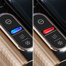 Obraz przedstawia dwa panele sterujące z przyciskami, jeden z niebieskim podświetleniem, drugi z czerwonym. Oba panele mają symbole fal i płatka śniegu.