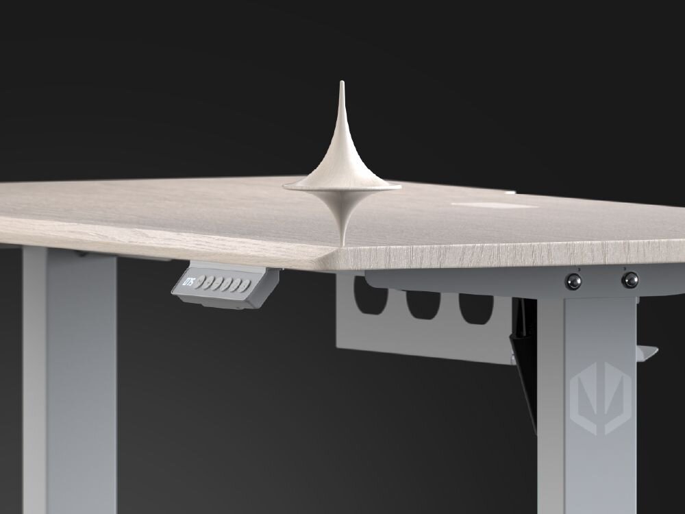 Biurko ENDORFY Atlas S Electric Jasne Drewno Blat biurka ENDORFY Atlas S Electric z wirującą zabawką bączkiem, symbolizującą stabilność stalowa konstrukcja dodatkowy wspornik