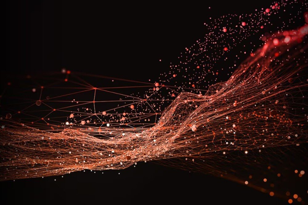 Procesor AMD Ryzen 7 9850X3D Graficzna reprezentacja sieci połączeń przypominająca siatkę neuronową lub dynamiczną wizualizację danych na czarnym tle z pomarańczowymi i czerwonymi punktami, sztuczna inteligencja, narzędzia AI