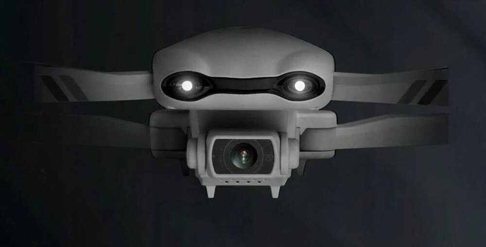 Dron EXTRALINK Smart Life F10 Przód drona z włączonymi dwoma diodami LED i widoczną kamerą w centralnej części