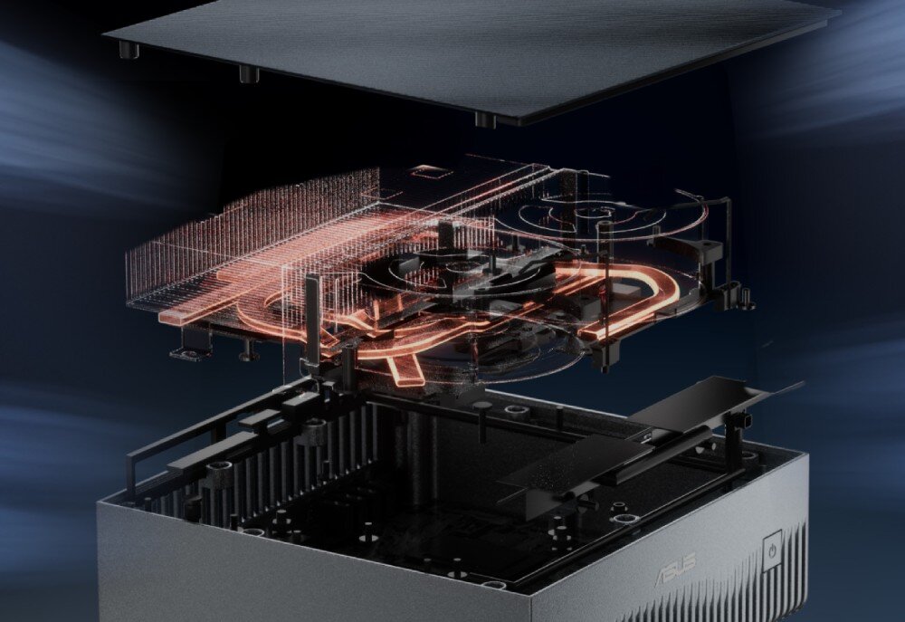 Komputer ASUS Ascent GX10 Rozłożony na części, otwarty srebrny komputer typu mini PC, pokazujący od dołu obudowę, nad nią skomplikowaną, ażurową strukturę z wieloma zakrzywionymi, świecącymi pomarańczowo miedzianymi rurkami cieplnymi