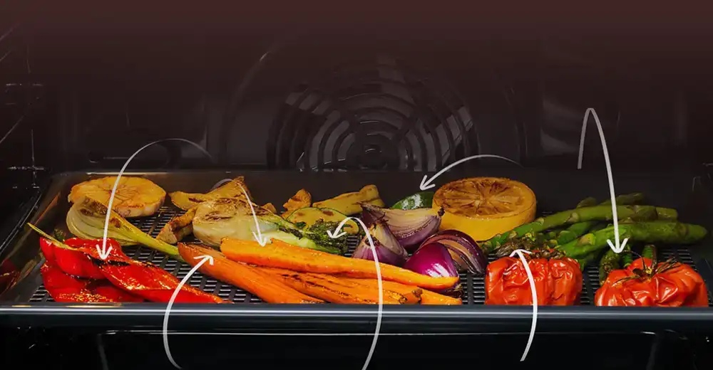 Blacha z upieczonymi warzymami i strzałkami imitującymi przepływające powietrze