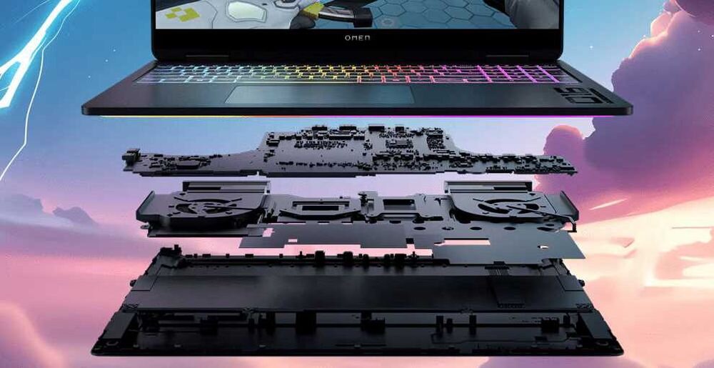 Laptop z widoczną klawiaturą i płytą główną, ukazujący wewnętrzne komponenty urządzenia.  - System chłodzenia  