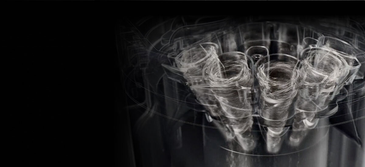 Wewnętrzna budowa urządzenia z widoczną technologią cyklonów w&nbsp;trakcie pracy