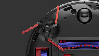 Ujęcie budowy urządzenia od spodu, w&nbsp;zbliżeniu widać szczotki boczne oraz szczotkę do zbierania włosów