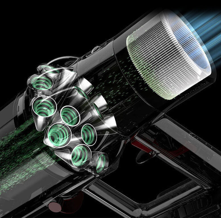 Obraz przedstawia wnętrze odkurzacza z widocznymi metalowymi rurkami i filtrem. Widać przepływ powietrza oznaczony zielonymi i niebieskimi liniami.