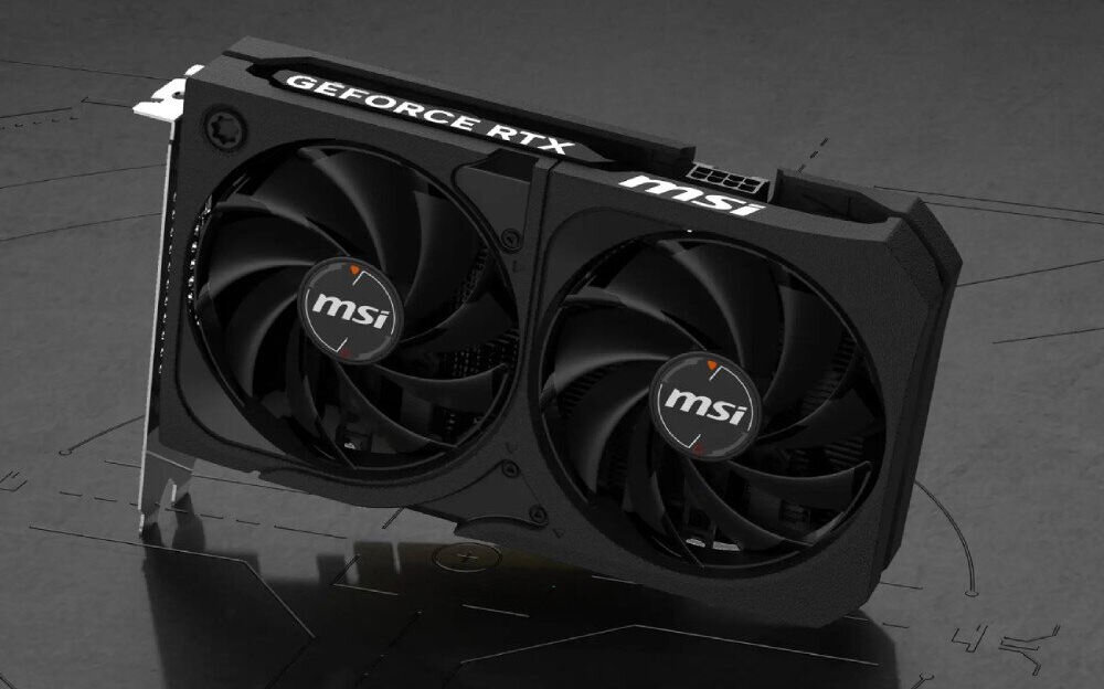 Komputer MAD DOG KRUX-EXO-A05WR32WH R5-7500F 32GB RAM 1TB SSD GeForce RTX5060 DLSS 4 Wi-Fi Windows 11 Home Zbliżenie na kartę graficzną z dwoma dużymi wentylatorami. Na obudowie widnieje logo producenta oraz napis 'GeForce RTX', karta graficzna, wydajność